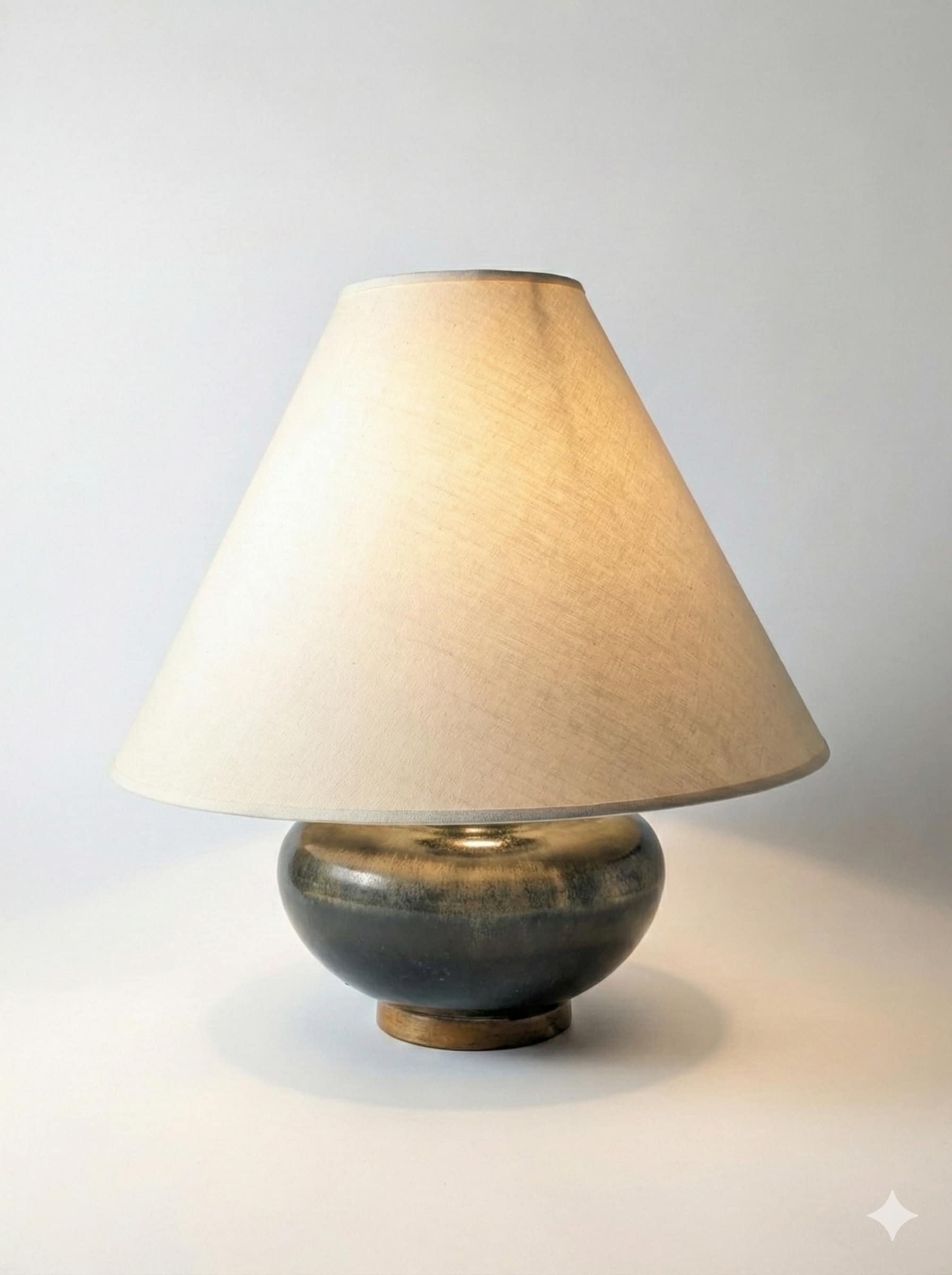 The Gathered table lamp lit